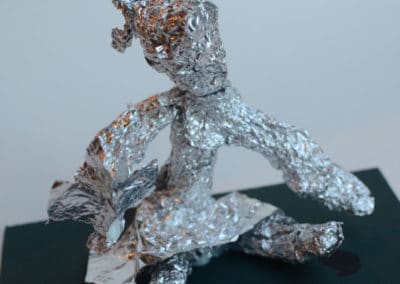 Tinfoil Sculpture of Girl Reading, age 7
